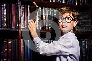 Intelligent boy in a library