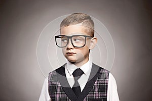 Intelligent child in glasses. elegant kid