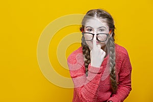 Intelligent Winsome Funny Smiling Caucasian Blond Girl In Coral Knitted Sweater Posing In Glasses While Correcting Glasses