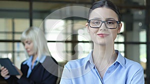 Intelligent woman in glasses posing on camera, employment of young professionals