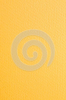Intence yellow paper background. Orange textured cardboard with no objects