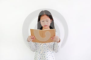 Intended young girl holding book for reading against white background