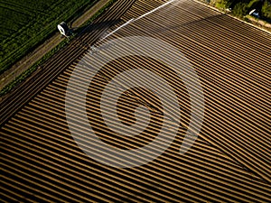 Intense agriculture fiekd being irrigatedwith huge amounts of water