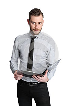 Intense businessman holding a clipboard