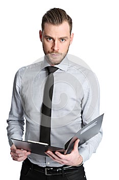 Intense businessman holding a clipboard