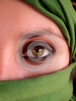 Intense green eyes of arabian girl