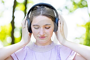 Intense Musical Connection: Young Woman in Serene Nature