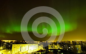 Intense northern lights (Aurora borealis) over city of Riga