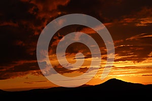 Intense Orange Clouds over the Mountain