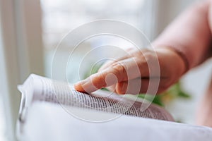Intense Reading Close-Up of Unrecognizable Hands Holding Literature