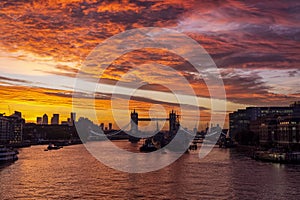 A intense, red sunrise behind the skyline of London, England