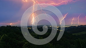 Intense thunderstome hitting landscape with several lightning bolts