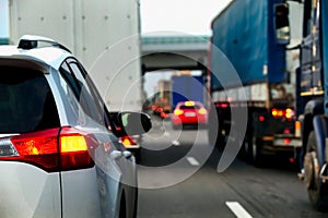 Intense traffic flow of trucks and cars on a highway.