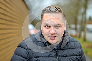 Intense young man staring into the camera with parted lips