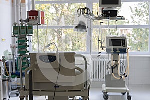 Intensive care unit in hospital, bed with monitor, ventilator, a place where they are treated patients with pneumonia caused by