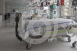 Intensive care unit in hospital, beds with monitors, ventilators, a place where can be  treated patients with pneumonia caused by