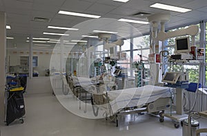 Intensive care unit in hospital, beds with monitors, ventilators, a place where can be  treated patients with pneumonia caused by