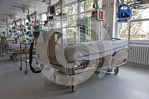 Intensive care unit in hospital, beds with monitors an ventilators, a place where they are treated patients with pneumonia caused