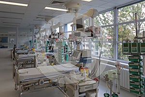 Intensive care unit in hospital, beds with monitors, ventilators, a place where they are treated patients with pneumonia caused by