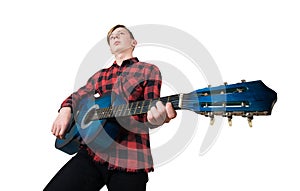 Intent adolescent playing on the acoustic guitar isolated over white background. Music lessons for students. Talented boy want to