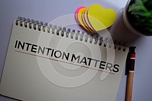 Intention matters write on a book isolated on office desk