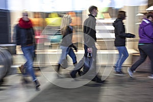 Intentional blurred image of people in shopping center photo