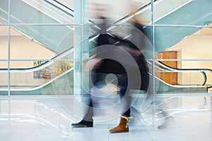 Intentional Blurred Image of Two Businesspeople in Office Building