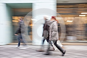 Intentional Blurred Image of Young People in Shopping Center photo