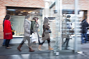 Intentional Blurred Image of Young People in Shopping Center