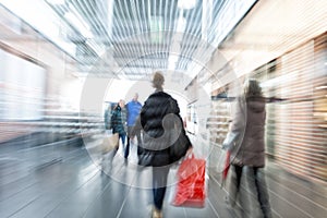 Intentional Blurred Image of Young People in Shopping Center