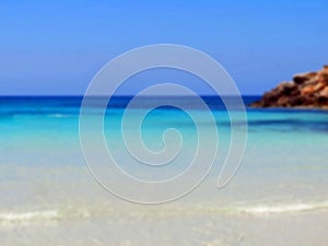 Intentionally blurred Caribbean panorama with water of many shades of azure blue and turquoiset