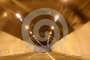 intentionally blurry illuminated highway tunnel ideal as travel concept