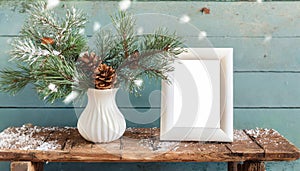 inter still life. Horizontal white frame mockup on vintage wooden bench, table. Modern white ceramic vase with pine tree branches