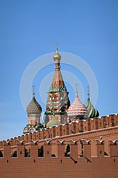 Intercession Cathedral on Red Square in Moscow view from behind the Kremlin wall on a bright sunny day