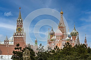 Intercession Cathedral or St. Basil`s Cathedral and the Spassky Tower of Moscow Kremlin at Red Square in Moscow, Russia