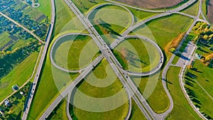 Interchange highway road network. Drone view highway crossing. Round road