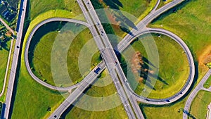 Interchange highway road. Round road aerial view. Cars traffic on circle road