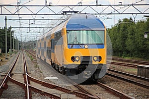 Intercity train V-IRM at the station of `t Harde between Utrecht and Zwolle.