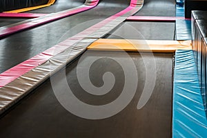 Interconnected trampolines for indoor jumping.