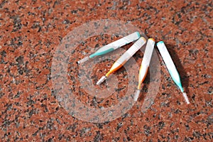 Interdental brushes on a marble plate