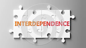 Interdependence complex like a puzzle - pictured as word Interdependence on a puzzle to show that it can be difficult and needs photo
