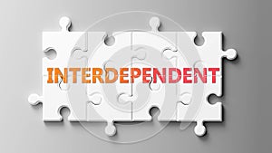 Interdependent complex like a puzzle - pictured as word Interdependent on a puzzle pieces to show that Interdependent can be