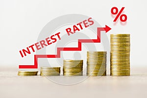 Interest rate financial and mortgage rates concept, stack of coin showing percentage increase graph interest rates rise