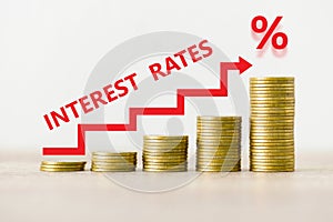 Interest rate financial and mortgage rates concept, stack of coin showing percentage increase graph interest rates rise photo