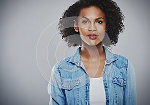 Interested black woman with blue jean shirt