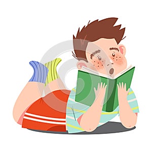Interested Boy Character Lying with Open Book and Reading Vector Illustration