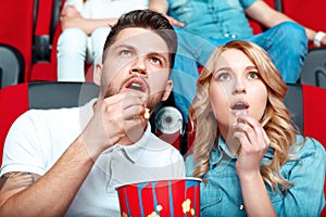 Interested couple in cinema