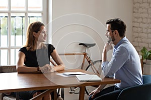 Interested hr manager listening to skilled candidate during interview photo