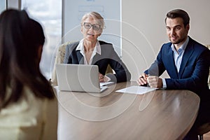 Interested hr managers focused on listening applicant at job interview