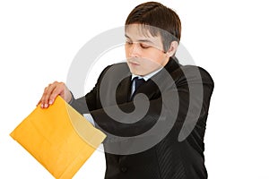 Interested young businessman checking parcel